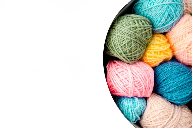 Colorful balls of wool with knitting needles on white background,hobby and free time concept. yarns for knitting copyspace