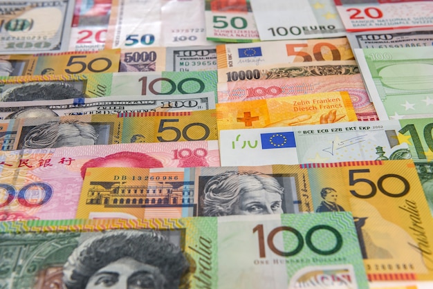 Colorful banknotes of different countries as background close up