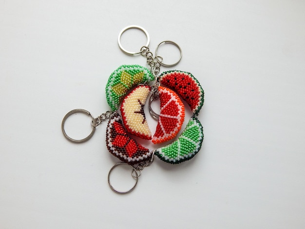 Colorful bead key chains on a white background