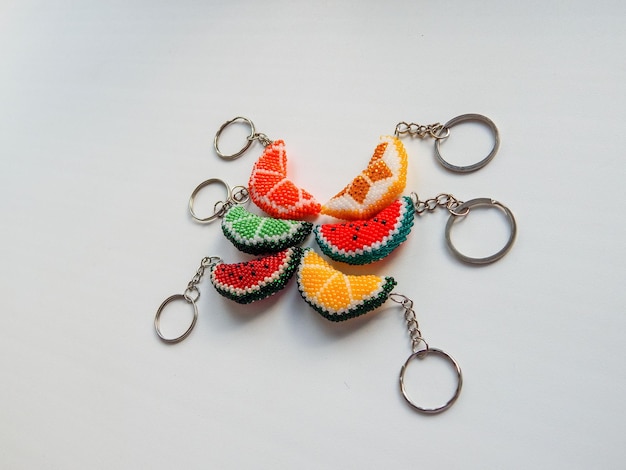 Colorful bead key chains on a white background