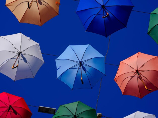 Colorful and beautiful umbrellas hanging in the city street decoration