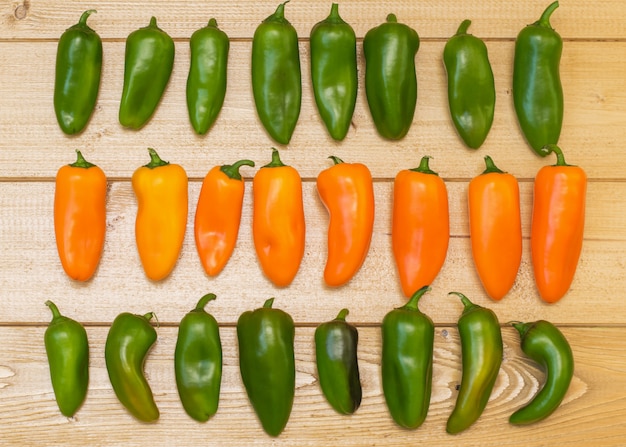 Colorful bell pepper on a wooden table.