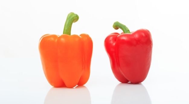 Colorful bell peppers on white background