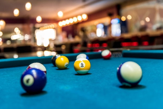 Colorful billiard balls on table, game and gambling