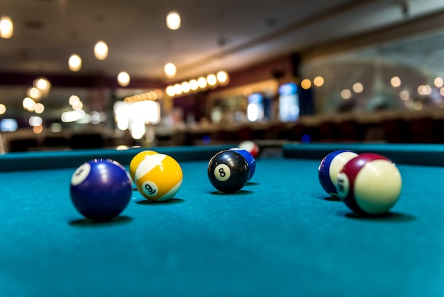 Colorful billiard balls on table, game and gambling