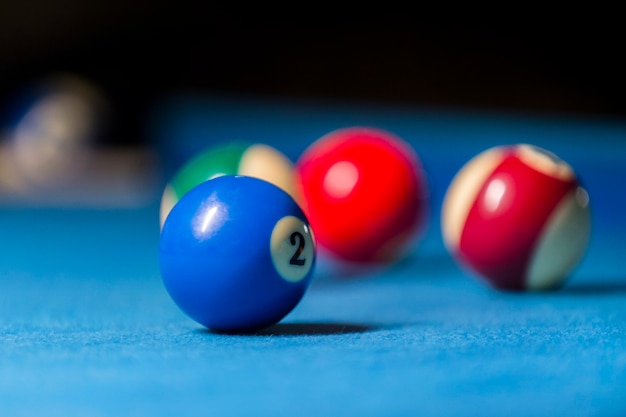 Photo colorful billiards balls. billiard ball at blue table