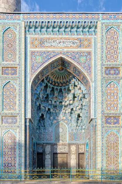 Colorful blue and turquoise traditional mosaic decorating the mosque. Oriental ornament on the facade of the Muslim Dome. Mosque in Saint Petersburg, Russia. Eastern culture and religion.