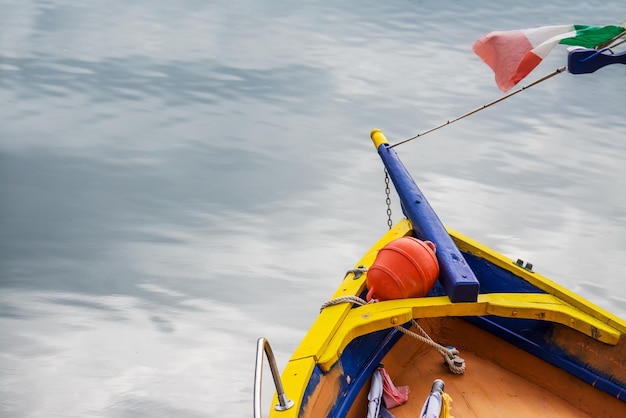 Colorful boat by the shore in Temo river Shot in Sardinia Italy