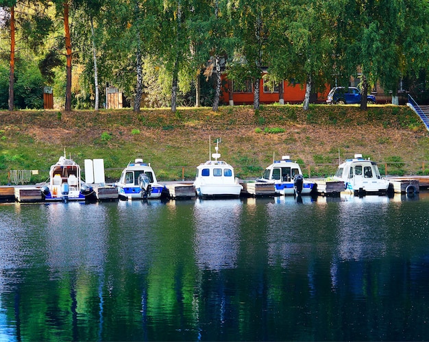 Colorful boat pier at fall park background