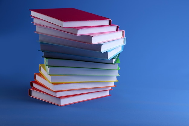 Colorful books on blue background