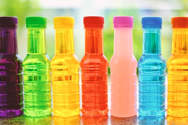 Colorful bottles arranged in a horizontal row