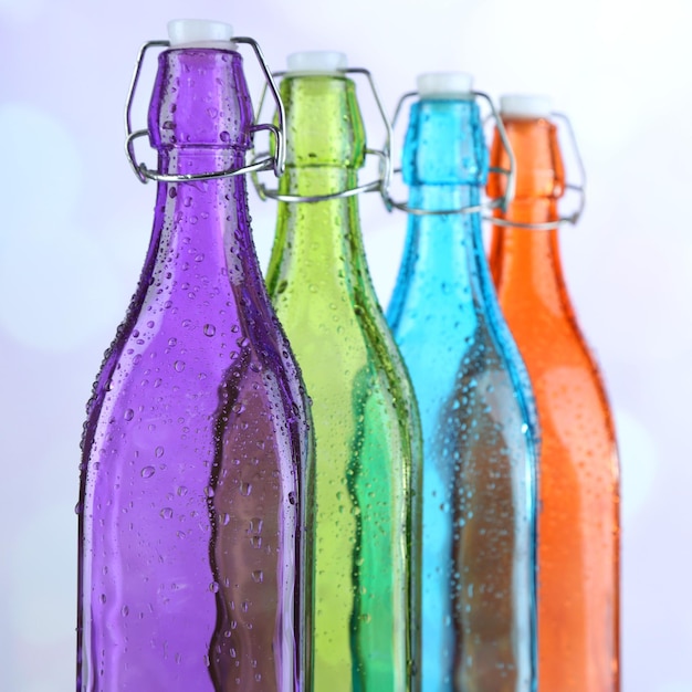 colorful bottles on light background