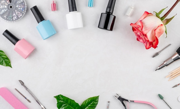 Colorful bottles of nail polishes and tools and accessories for manicure and pedicure procedures