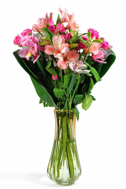 Colorful bouquet of flowers in a vase Isolated on a white background Vertical photograph