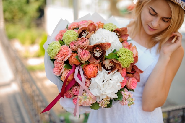 Colorful bouquet in the hands of the bride