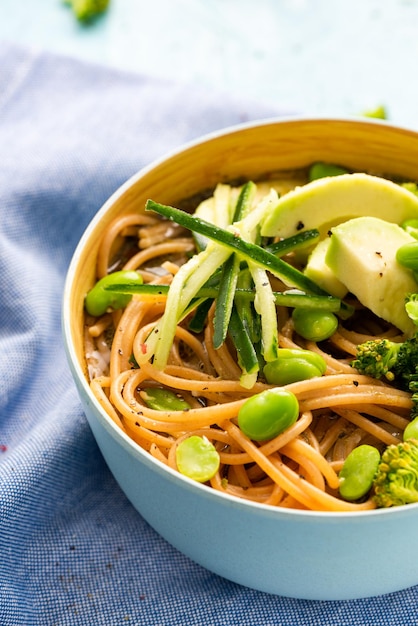 Colorful Bowl with Noodles AvocadoBroccoli and Edamame Beans Clean Eating