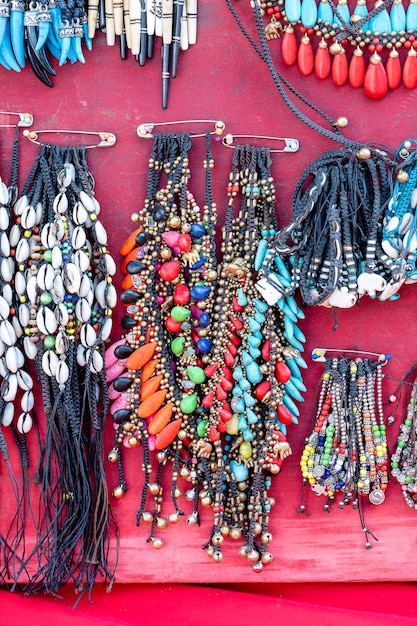 Colorful bracelets for sale on street at night market Thailand Souvenirs for tourists at market close up