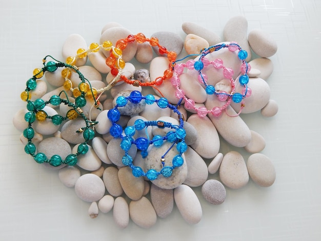 Colorful bracelets and sea stones