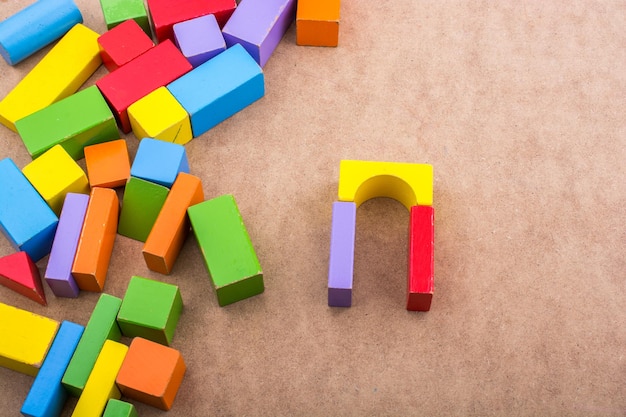 Colorful building blocks on brown background