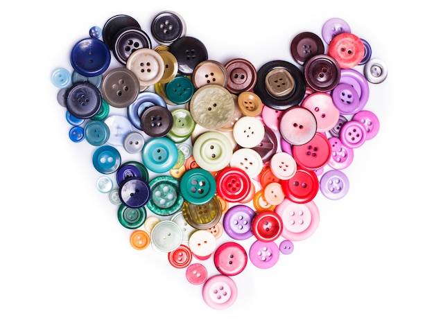 Colorful buttons as a heart shape isolated on white