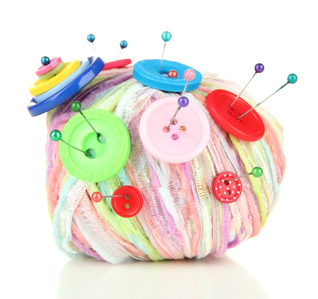 Colorful buttons and multicolor wool ball, isolated on\
white