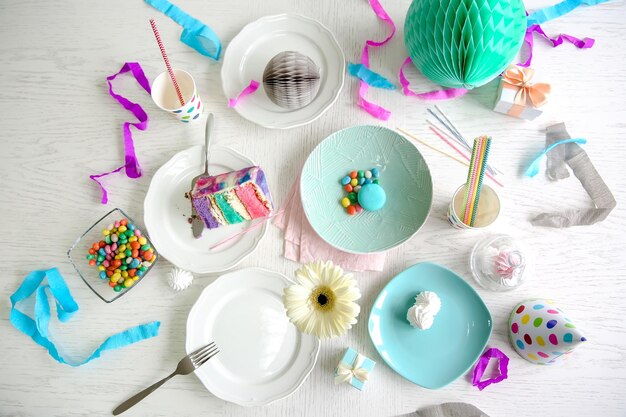 Colorful cake slice on white festive table