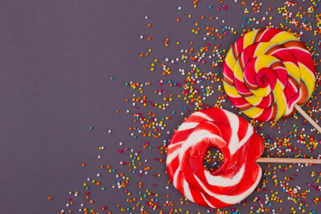 Colorful candies on dark background.