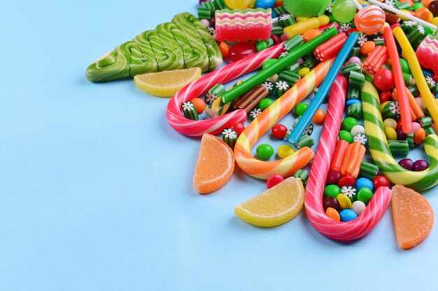 colorful candies on light blue background