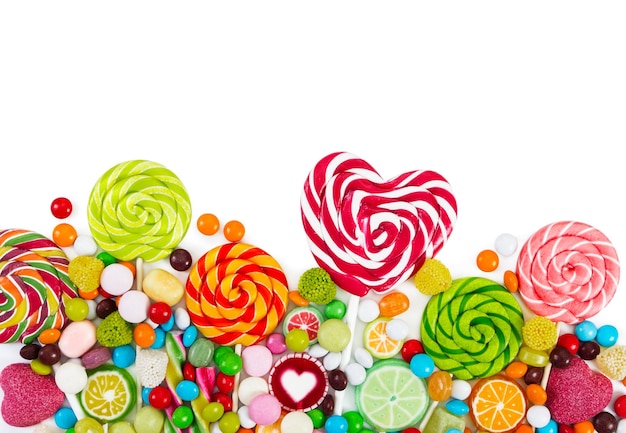 Colorful candies and lollipops Top view