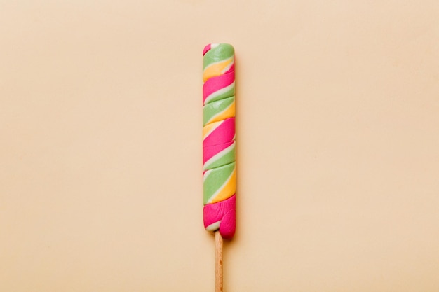 Colorful candies lollypop on the colorful background multicolored minimal style top view