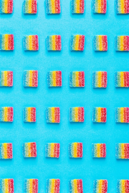 Colorful candies pattern on a blue background