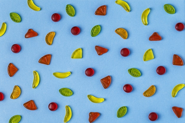 Colorful candies pattern on a bright background