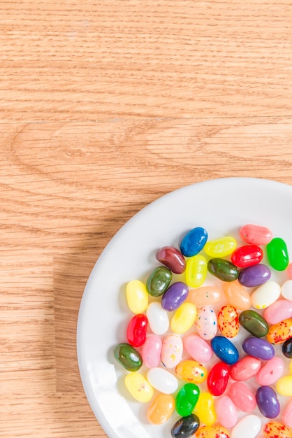 Colorful candy in white plate