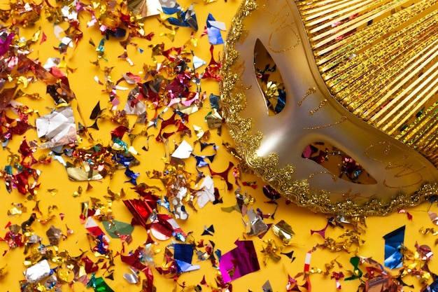 Colorful carnival mask on the with several ornaments