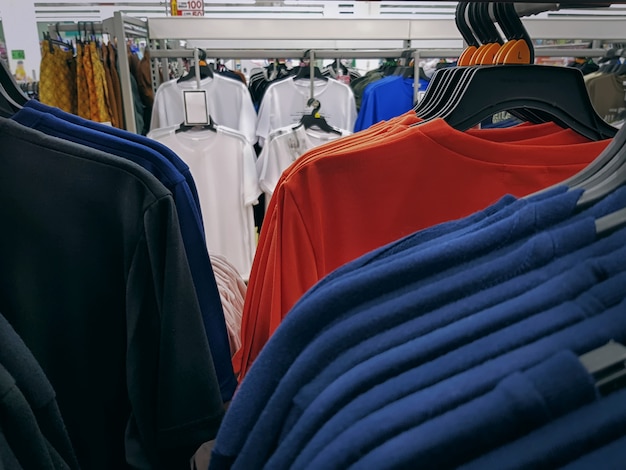 Colorful Casual T-Shirts Hanging on the Racks at Clothing Store