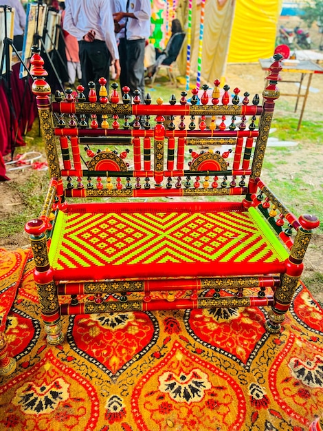 A colorful chair with a red and yellow pattern on it