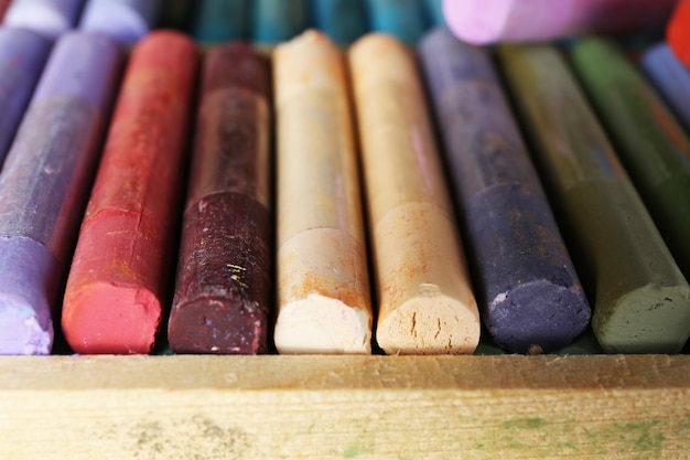 Colorful chalk pastels in box close up