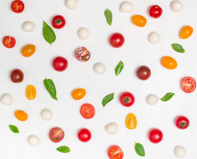 Colorful cherry tomato basil and baby mozzarella pattern