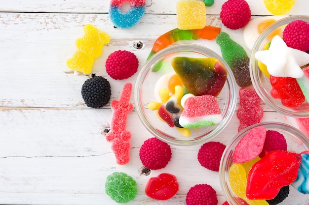 Colorful childs sweets and treats on wooden table