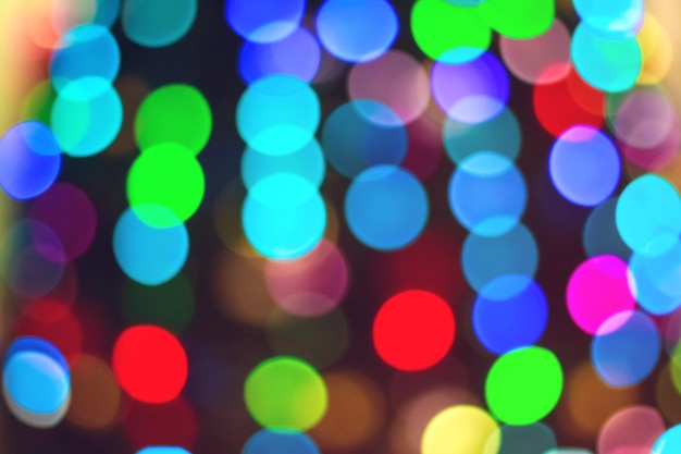 Foto sfondo colorato di natale. sfondo bokeh luce scintillante