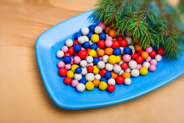 Photo colorful christmas candies on plate