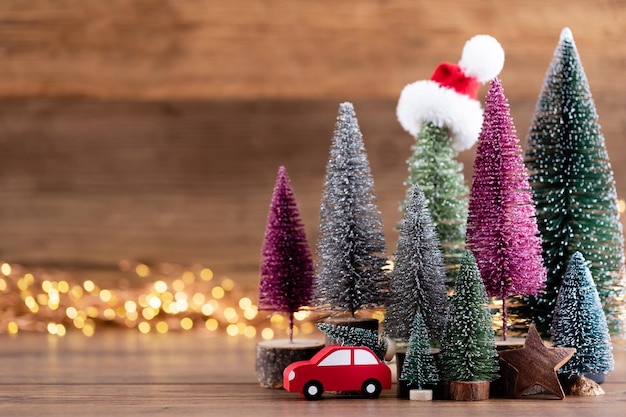 Colorful Christmas tree on wooden bokeh background