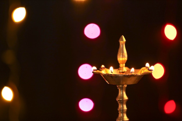 Colorful clay diya lamps lit during diwali celebration