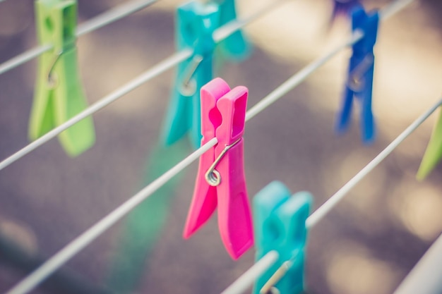 Colorful clothe pegs on a clothes line