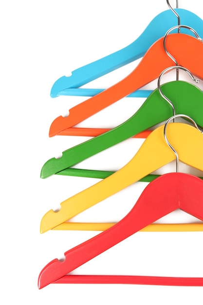 Colorful clothes hangers isolated on white