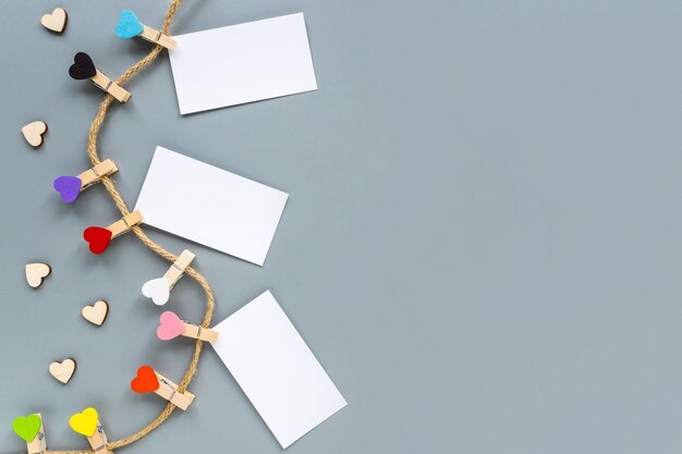 Colorful clothespins in the form of hearts on a rope