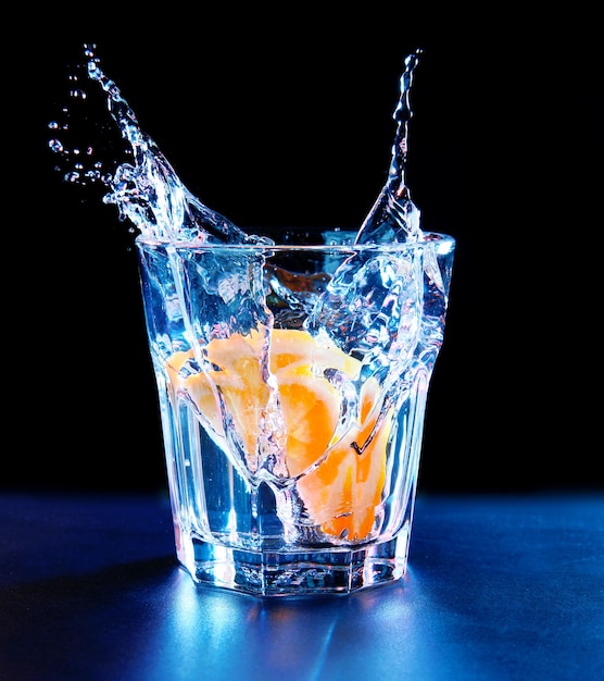 Colorful cocktail with splash on dark background