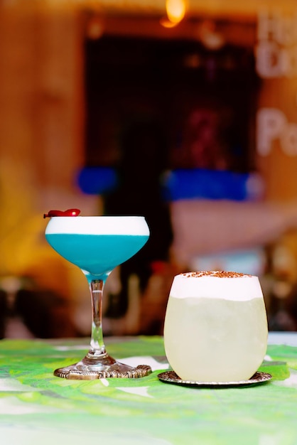 Colorful cocktails standing on the table on bar's terrace outdoor