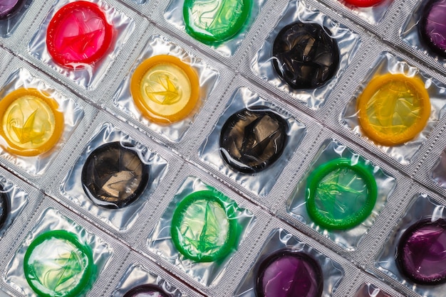 Colorful condoms background. Top view.