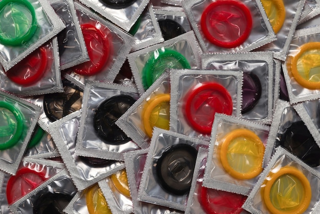 Colorful condoms background. Top view.